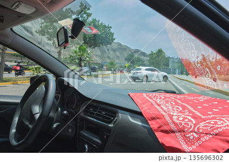 Driving home on a sunny day in a car 135696302