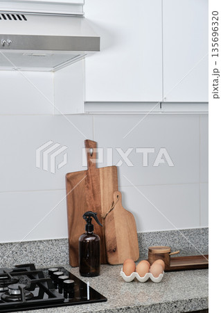 Modern kitchen countertop with chopping boards and fresh eggs Modern kitchen countertop with chopping boards and fresh eggs 135696320