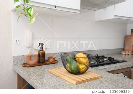 Kitchen counter with fruit bowl and cooking area 135696329