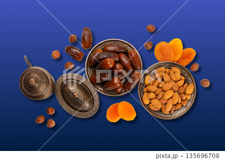 Traditional dried fruits and nuts arranged for Ramadan festivity Traditional dried fruits and nuts arranged for Ramadan festivity 135696708