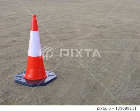 Traffic Cone on Road Surface Traffic Cone on Road Surface 135699111