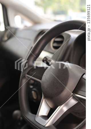 Car Steering Wheel and Dashboard Features Car Steering Wheel and Dashboard Features 135699121
