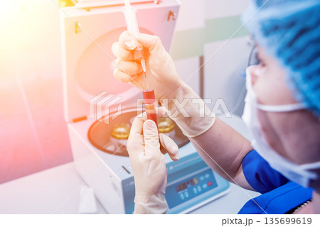 Platelet-Rich plasma preparation. Plasma in syringe. Centrifuge. 135699619
