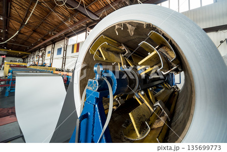 Rolled steel coils in storage areas of metalwork manufacturing. Rolled steel coils in storage areas of metalwork manufacturing. 135699773