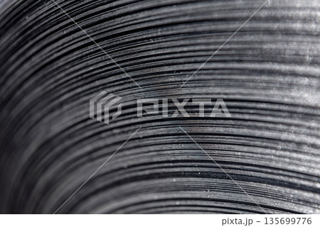 Curved lines of rolled metal are made of sheet steel. Curved lines of rolled metal are made of sheet steel. 135699776