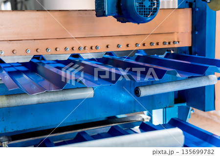 Metal sheet forming machine at the modern metalwork factory. 135699782