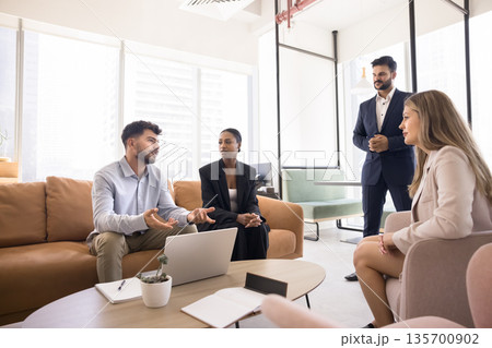 Millennial leader multiethnic team listen to young executive presenting idea Millennial leader multiethnic team listen to young executive presenting idea 135700902