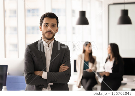 Portrait of confident, ambitious staff member posing in modern coworking Portrait of confident, ambitious staff member posing in modern coworking 135701043