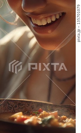 Close-up of Smiling Face Enjoying Homemade Dish in Warm Light Close-up of Smiling Face Enjoying Homemade Dish in Warm Light 135701079