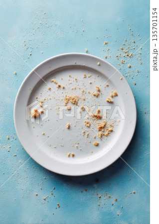 Empty Plate with Crumbs Flat Lay on Blue Background 135701154