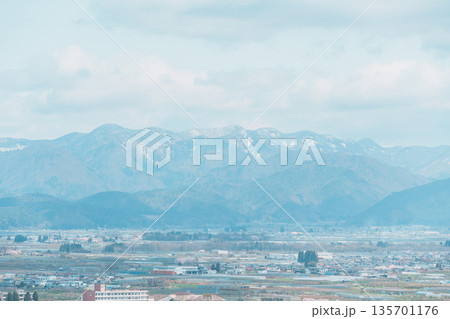 Tendo city with Sakura Cherry Blossom and snow mountain in Spring season, view from Tendo Park or Maizuru Park. Yamagata prefecture, Tohoku, Japan, 21 April 2025 135701176