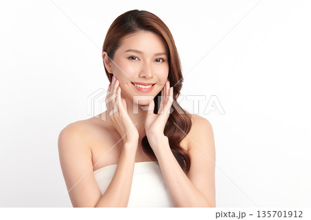 A beautiful young Asian woman with clean, fresh skin against a white background. Skincare, facial treatment, cosmetology, beauty, and spa. An elegant portrait of an Asian woman. A beautiful young Asian woman with clean, fresh skin against a white background. Skincare, facial treatment, cosmetology, beauty, and spa. An elegant portrait of an Asian woman. 135701912