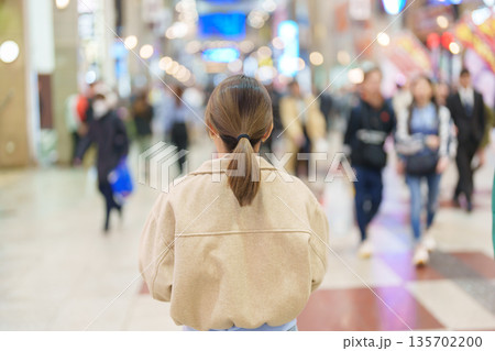 Woman tourist sightseeing Sendai shopping road. Happy traveler travel near Sendai station, Miyagi Prefecture, Japan. Famous Landmark and Vacation Woman tourist sightseeing Sendai shopping road. Happy traveler travel near Sendai station, Miyagi Prefecture, Japan. Famous Landmark and Vacation 135702200