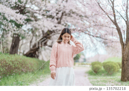 Woman tourist sightseeing Kajo Park Yamagata Castle Ruins with Sakura Cherry Blossom in Spring, happy traveler travel in Yamagata prefecture, Tohoku, Japan. famous Landmark for Travel and Vacation Woman tourist sightseeing Kajo Park Yamagata Castle Ruins with Sakura Cherry Blossom in Spring, happy traveler travel in Yamagata prefecture, Tohoku, Japan. famous Landmark for Travel and Vacation 135702218