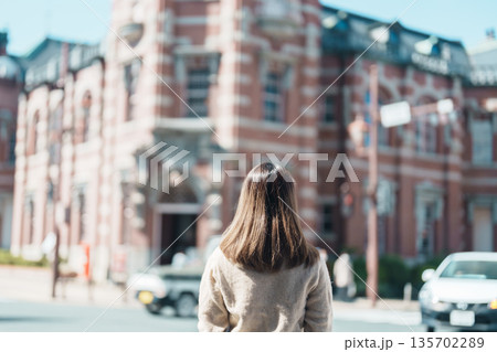 Woman tourist sightseeing at Bank of Iwate Red Brick Building, happy traveler travel in Morioka city, Iwate prefecture, Japan. famous Landmark Travel and Vacation destination 135702289