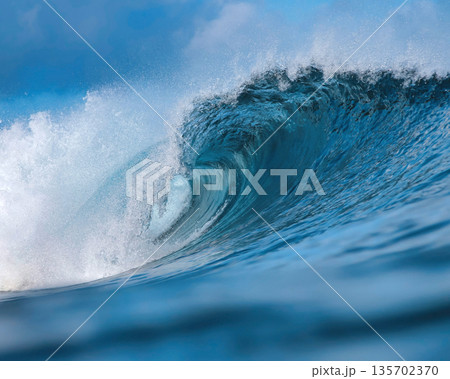 Vast Ocean Wave Crashing Fiercely, Powerful Surf Surging Beneath Bright Sky 135702370