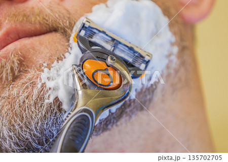 Close Up Man Shaving Beard Close Up Man Shaving Beard 135702705