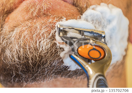 Close Up Man Shaving Beard Close Up Man Shaving Beard 135702706