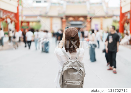 Woman traveling in Wat Mangkorn Kammalawas, Leng Nuei Yee as Chinese temple. Asian traveler visiting at Yaowarat road or Chinatown of Bangkok, landmark and popular for tourist attractions in Thailand Woman traveling in Wat Mangkorn Kammalawas, Leng Nuei Yee as Chinese temple. Asian traveler visiting at Yaowarat road or Chinatown of Bangkok, landmark and popular for tourist attractions in Thailand 135702712