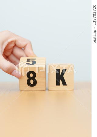 hand change wooden block from 5K to 8K, display resolution, Ultra High Definition, UHD, pixels, Technology, network, TV streaming, Social media and digital concepts 135702720