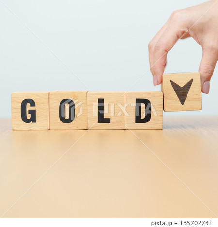 Hand change wood cube block with GOLD text to UP and Down arrow symbol icon.price, down and up, decrease and increase, cut loss, stocks, financial and economic concept Hand change wood cube block with GOLD text to UP and Down arrow symbol icon.price, down and up, decrease and increase, cut loss, stocks, financial and economic concept 135702731