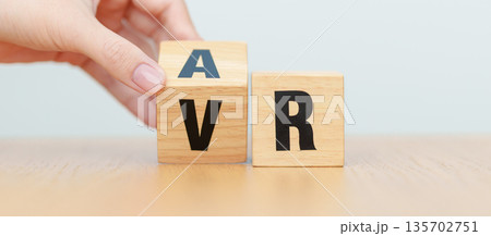 hand change wooden block from VR to AR, VIRTUAL and AUGMENTED REALITY, MR, Mixed Reality, XR, Extended, Metaverse and Immersive Technology concept hand change wooden block from VR to AR, VIRTUAL and AUGMENTED REALITY, MR, Mixed Reality, XR, Extended, Metaverse and Immersive Technology concept 135702751