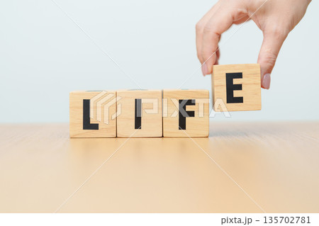 hand change wooden block Live to Life. Lifestyle, Live your life, learning, motivation and mindset concepts 135702781