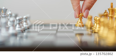 hand moving gold Chess King figure and Checkmate opponent during chessboard competition. Strategy, Success, management, business planning, win, disruption, Trade war and leadership concept hand moving gold Chess King figure and Checkmate opponent during chessboard competition. Strategy, Success, management, business planning, win, disruption, Trade war and leadership concept 135702802