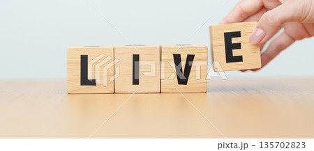 hand change wooden block Live to Life. Lifestyle, Live your life, learning, motivation and mindset concepts 135702823