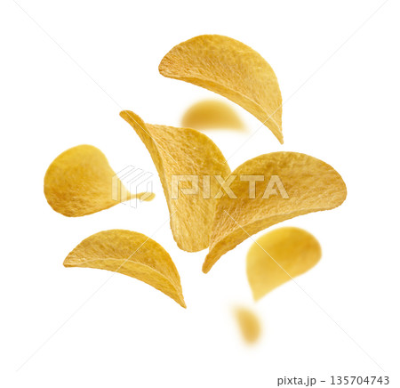 Potato chips levitate on a white background Potato chips levitate on a white background 135704743