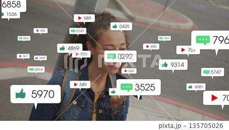 Walking woman smiling and checking smartphone on corner sidewalk, with backpack and social icons Walking woman smiling and checking smartphone on corner sidewalk, with backpack and social icons 135705026