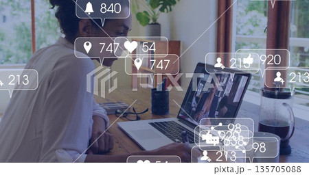 Woman wearing white shirt writing in notebook in home office, with laptop, eyeglasses, copy space Woman wearing white shirt writing in notebook in home office, with laptop, eyeglasses, copy space 135705088