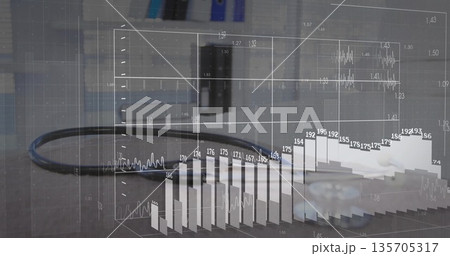 Displaying black cable with 3D data overlay on grey office desk, featuring gear piece and monitor Displaying black cable with 3D data overlay on grey office desk, featuring gear piece and monitor 135705317