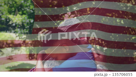 Hugging soldier father and son sharing reunion at grassy park, camouflage uniform and patrol cap Hugging soldier father and son sharing reunion at grassy park, camouflage uniform and patrol cap 135706055