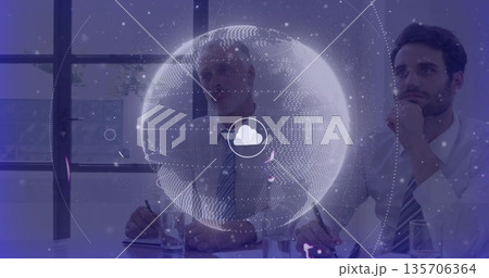 Two colleagues studying floating holographic globe with cloud icon in conference room, holding pens Two colleagues studying floating holographic globe with cloud icon in conference room, holding pens 135706364