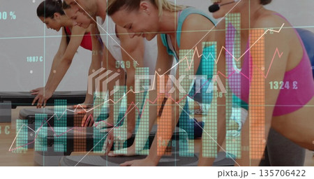 Performing participants in activewear planking in fitness studio with steps, mats and data charts 135706422
