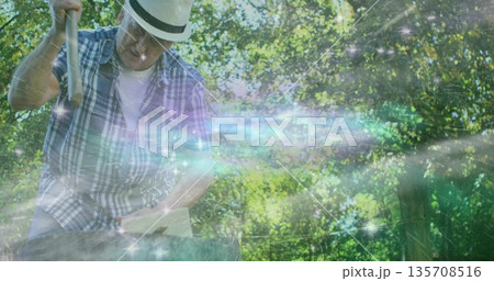 Chopping wood straw-hatted man wielding axe on stump in forest under nebula-glow, copy space Chopping wood straw-hatted man wielding axe on stump in forest under nebula-glow, copy space 135708516