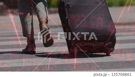 Walking woman wearing gray trousers pulling black suitcase across urban crosswalk with data overlay Walking woman wearing gray trousers pulling black suitcase across urban crosswalk with data overlay 135708661