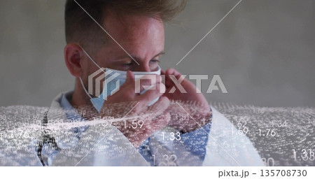 Adjusting doctor in white lab coat securing surgical mask in clinic with data overlay Adjusting doctor in white lab coat securing surgical mask in clinic with data overlay 135708730