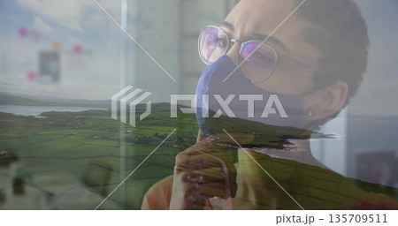 Gazing woman wearing mask and eyeglasses touching chin over farmland and coastal bay, copy space Gazing woman wearing mask and eyeglasses touching chin over farmland and coastal bay, copy space 135709511