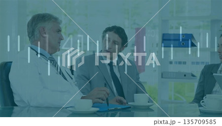 Two professionals discussing patient data in office meeting room, with stethoscope, digital charts Two professionals discussing patient data in office meeting room, with stethoscope, digital charts 135709585