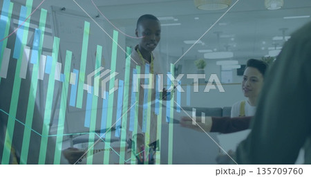 Collaborating team analyzing data around desk in office, with laptop smartphone report data overlay Collaborating team analyzing data around desk in office, with laptop smartphone report data overlay 135709760