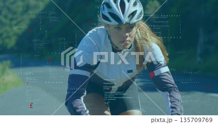Riding cyclist wearing white navy jersey and helmet on rural road, sunlight filtering through trees Riding cyclist wearing white navy jersey and helmet on rural road, sunlight filtering through trees 135709769