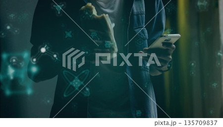 Holding smartphone, man in denim jacket and eating sandwich in train car, with holographic icons Holding smartphone, man in denim jacket and eating sandwich in train car, with holographic icons 135709837