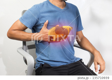 Man Concerned About Fatty Liver Disease and Health Risks 135710939