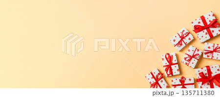 Top view colorful valentine background made of gift boxes with red hearts. Valentine's Day concept with copy space 135711380