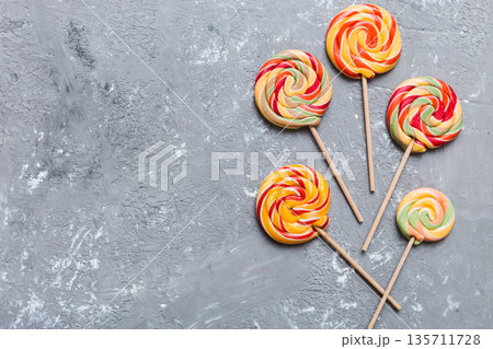 Set of colorful lollipops on colored background. Summer concept. Party Happy Birthday or Minimalist Concept 135711728