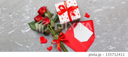 Valentine day composition with Envelope, rose flower and Red heart on table. Top view, flat lay. Holiday concept 135712411