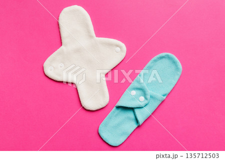 Eco-friendly reusable fabric women's pads. set of colorful bright reusable menstrual pads. zero waste woman periods concept top view with copy space 135712503