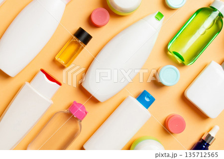 Group of plastic bodycare bottle Flat lay composition with cosmetic products on colored background empty space for you design. Set of White Cosmetic containers, top view with copy space 135712565